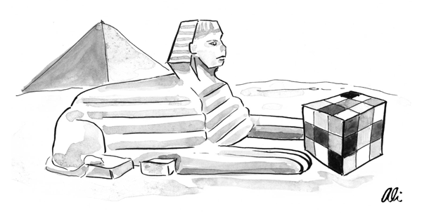A giant Rubik's cube sits in front of the Sphinx.