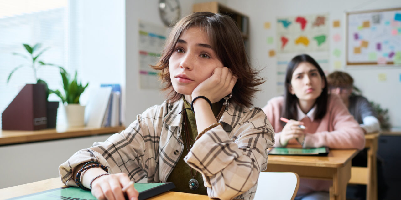 A bored student wants to ask their teacher for student involvement opportunities